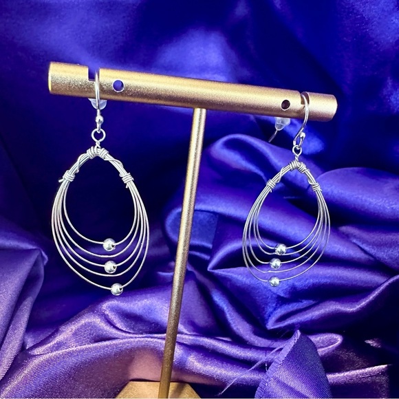 Multi Hoops with moving silver balls dangle earrings. - Picture 4 of 12